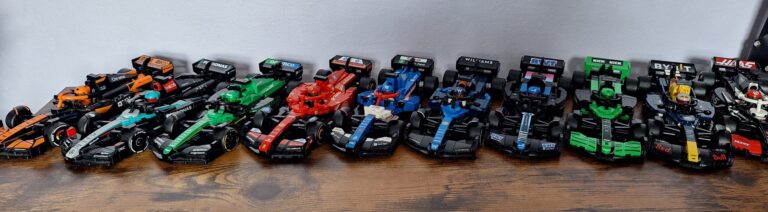 LEGO Speed Champions F1 cars displayed on a shelf